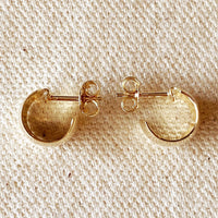 3: A pair of wide and thick chunky mini hoop earrings with post back in gold.