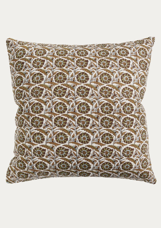 A square throw pillow featuring an intricate repeating block-print style pattern in brown, beige, and white, set against a solid light gray background.