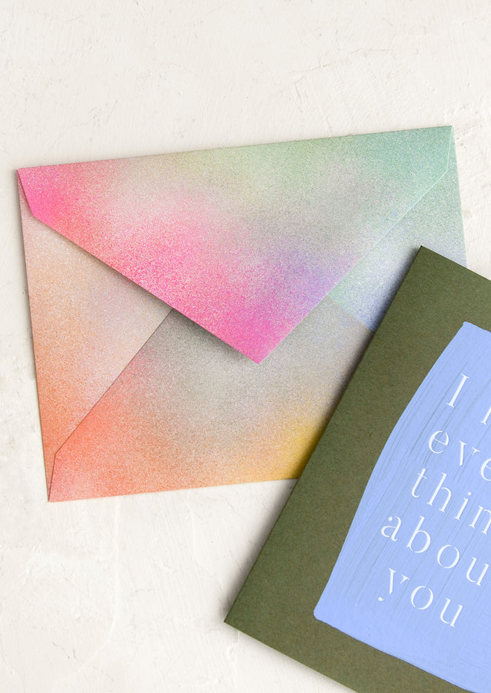 A rainbow colored envelope with airbrushed look.