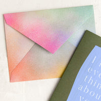2: A rainbow colored envelope with airbrushed look.