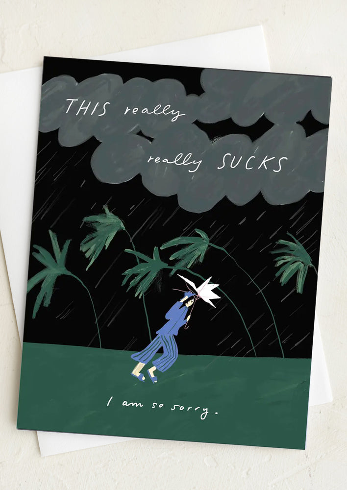 An illustrated greeting card of a woman walking through stormy weather.