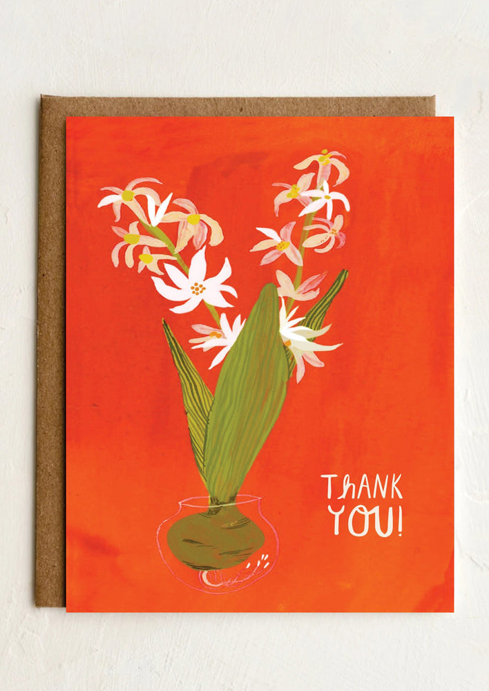 A red thank you card with paperwhites illustration reading "Thank you!'.