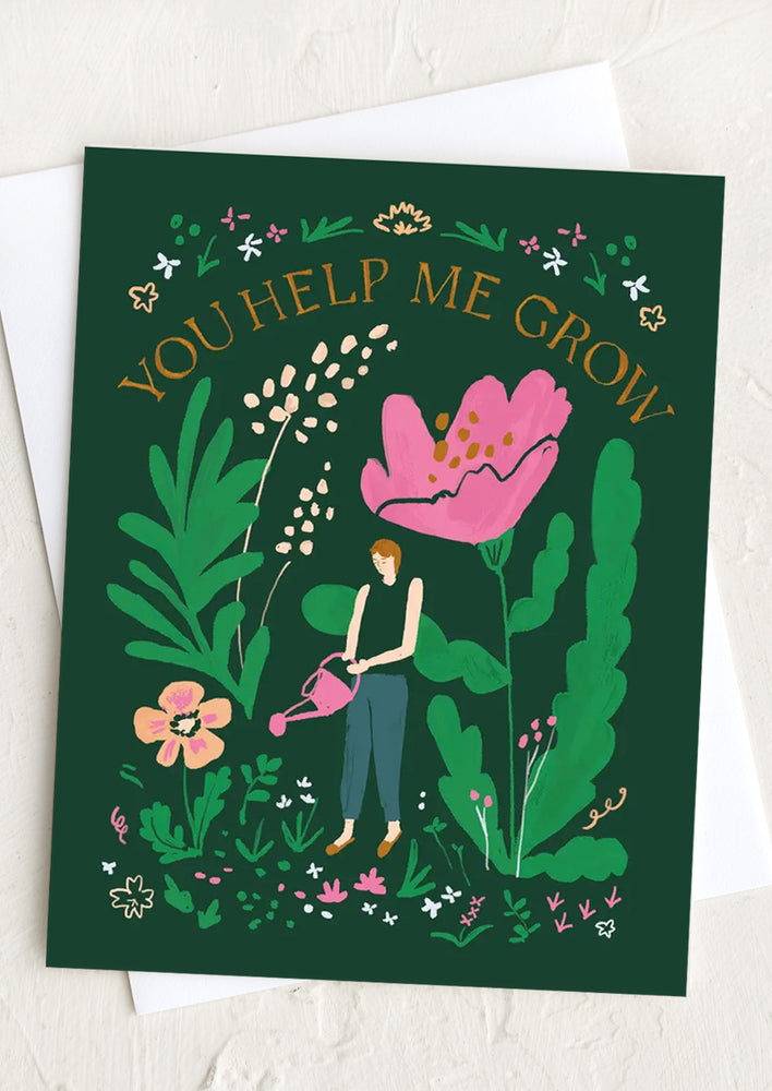 An illustrated green greeting card with drawing of woman watering flowers.