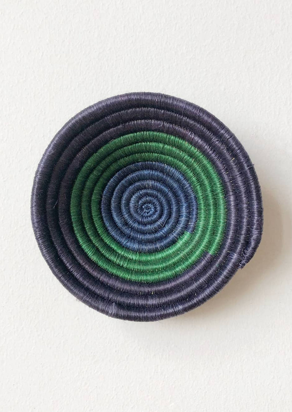 Navy / Kelly Green / Cobalt: A woven sweetgrass bowl in navy and green.