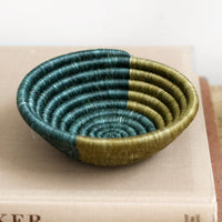 2: A woven sweetgrass bowl in lagoon and olive.