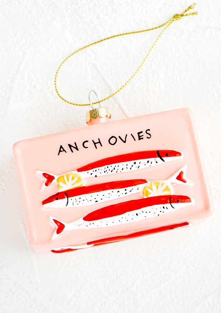 A holiday ornament in the shape of a tin of anchovies.