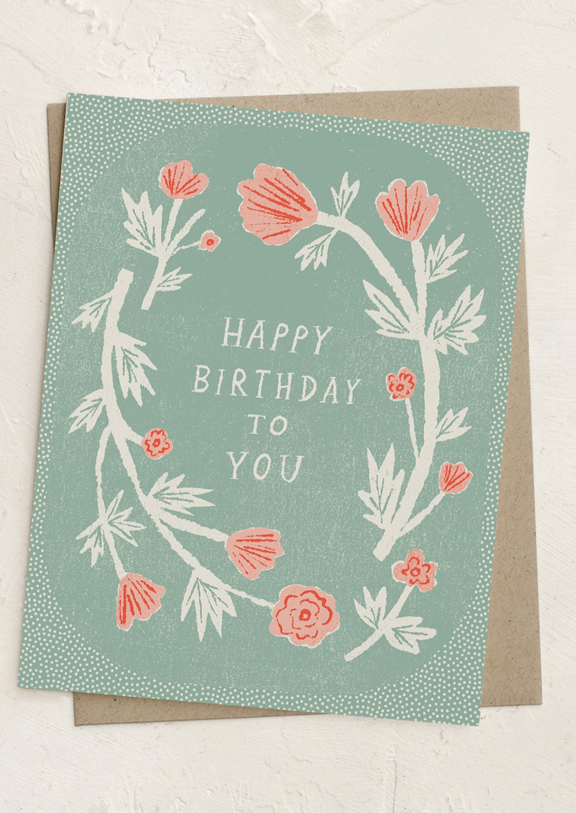 Greeting card with floral design and 'Happy Birthday to You' text on a light blue background.