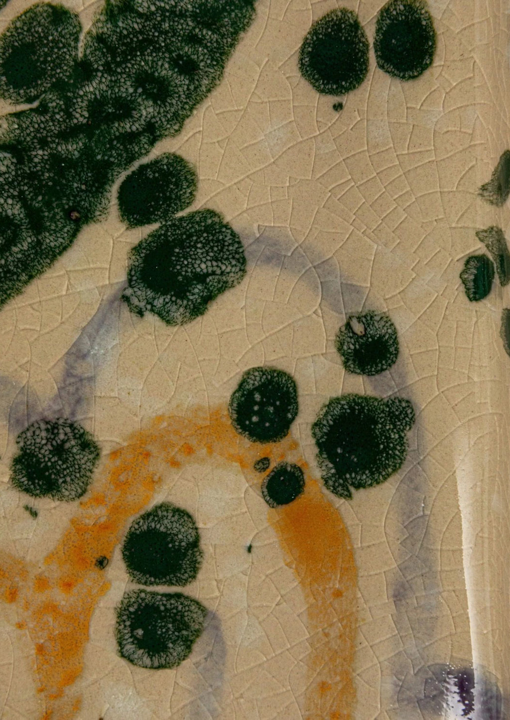 5: Multicolor splatter detail on ceramic.