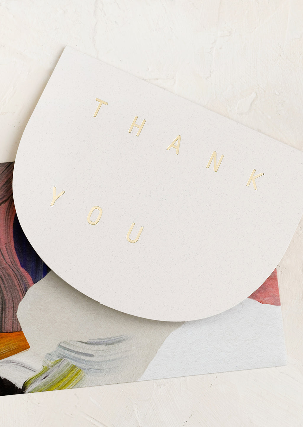 1: An arch shaped card reading "THANK YOU" in gold letters.