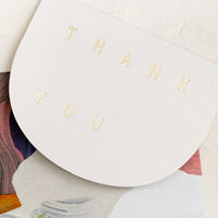 1: An arch shaped card reading "THANK YOU" in gold letters.