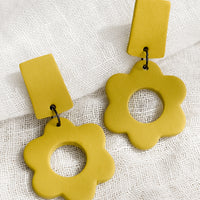 Lemon Rind: A pair of clay flower earrings with bar-shape post back in lemon rind yellow..