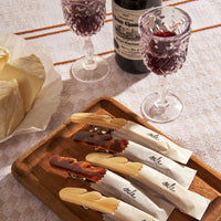 1: Baguette hair clips on a table setting.