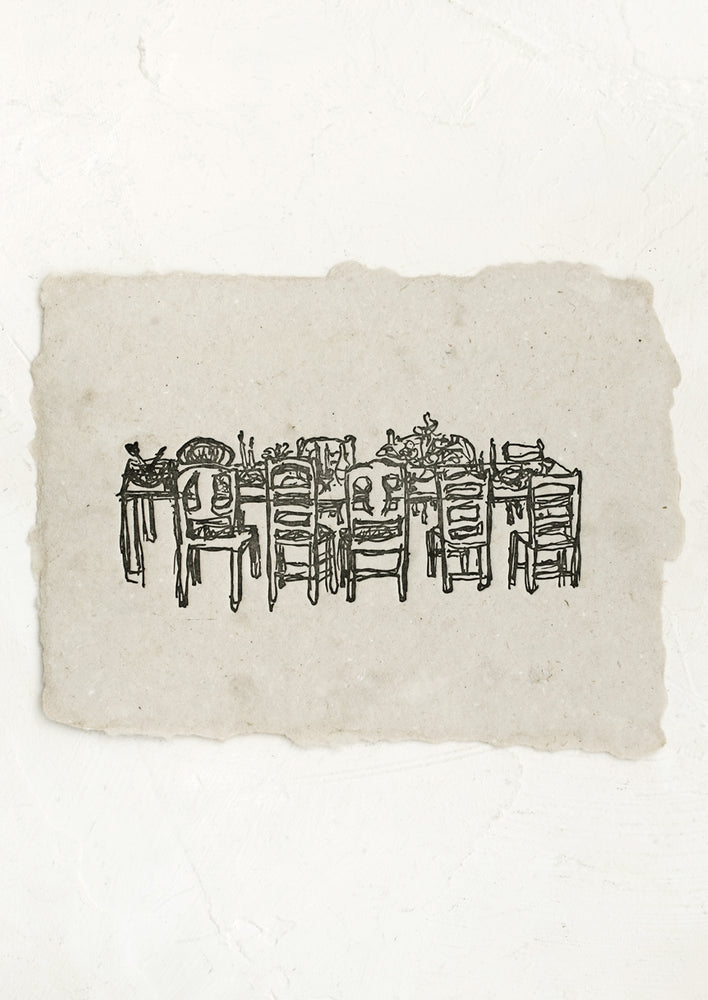 1: An art print made from grey handmade paper with letterpressed image of a dining table with chairs.
