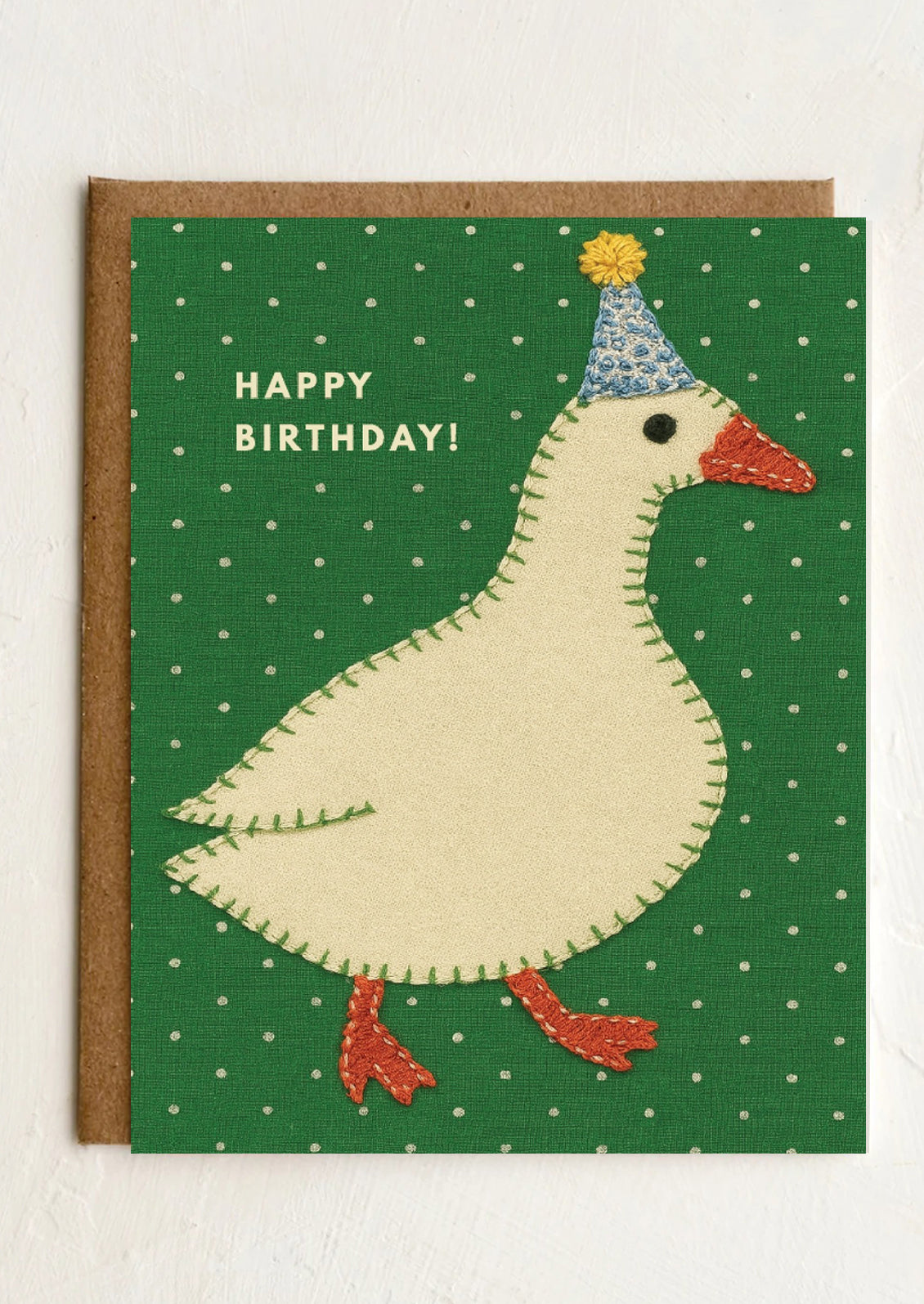 Birthday card with a goose illustration on a green polka dot background