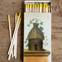 1: A box of yellow-tipped matches, box has vintage inspired beehive illustration.