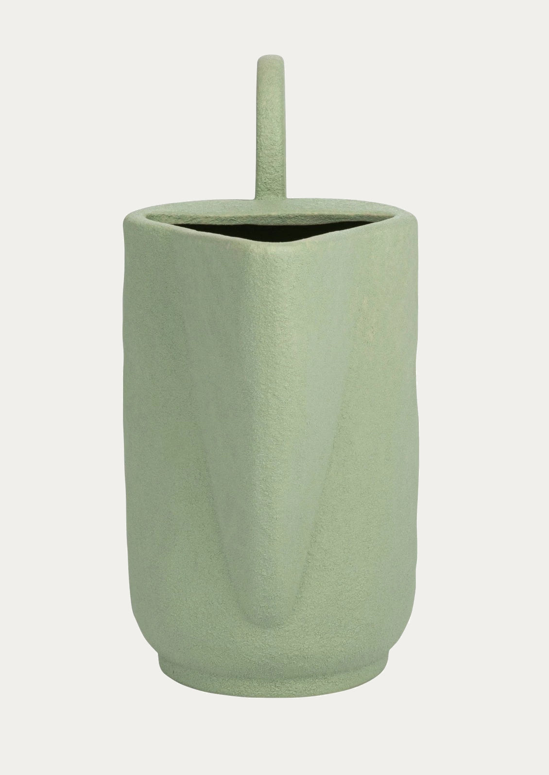 Mint green ceramic pitcher with exaggerated, sculptural shape.