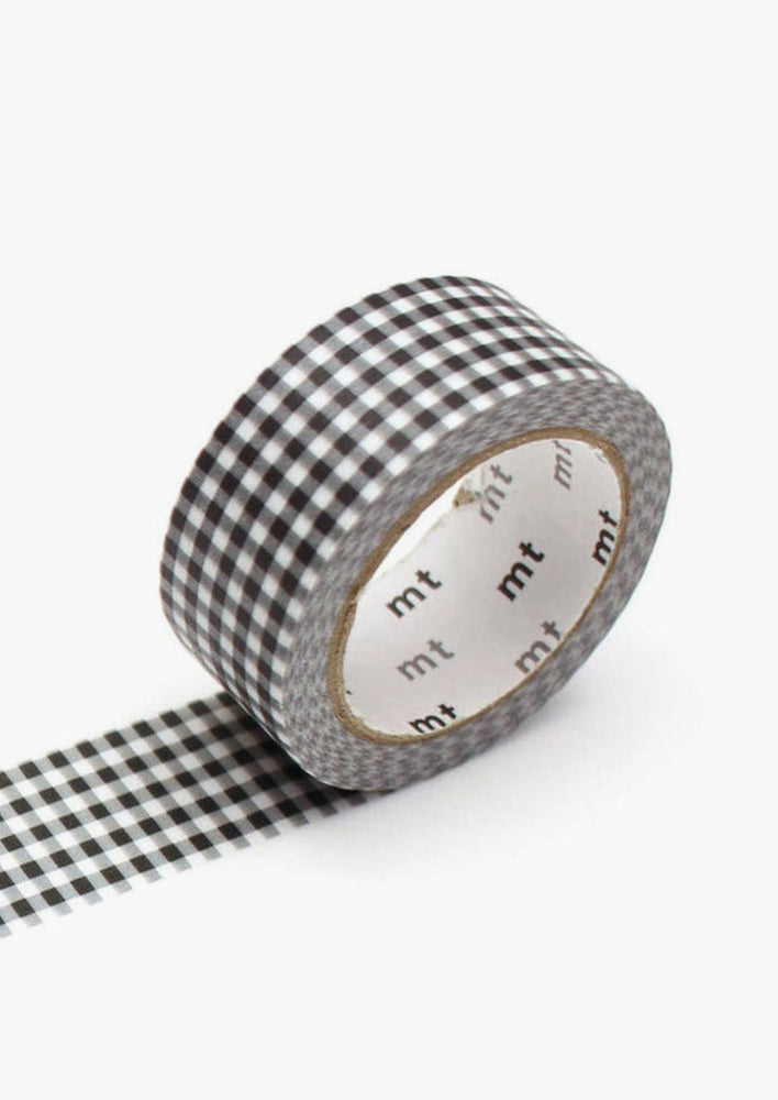 16: A roll of washi tape in black and white gingham.