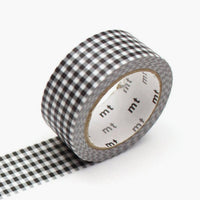 16: A roll of washi tape in black and white gingham.