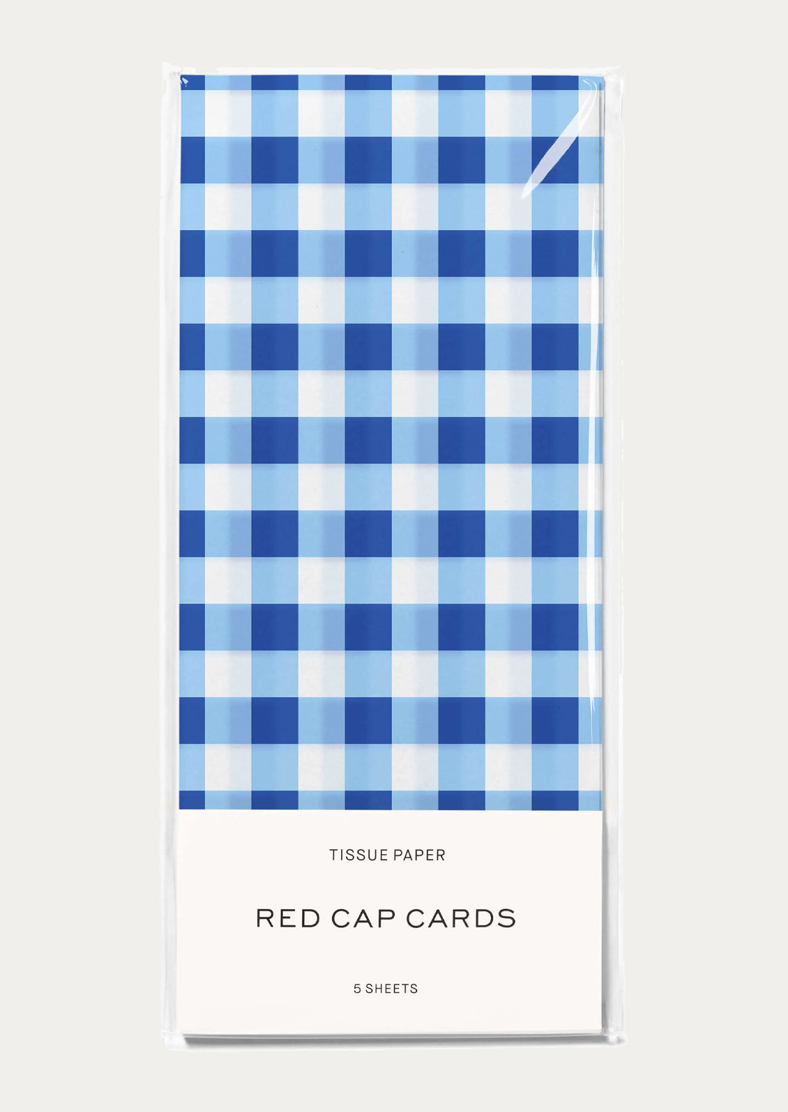 A pack of tissue paper featuring a blue and white gingham checkered pattern.