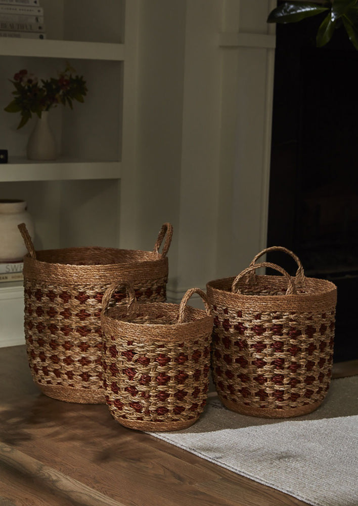 Woven seagrass baskets in three sizes.