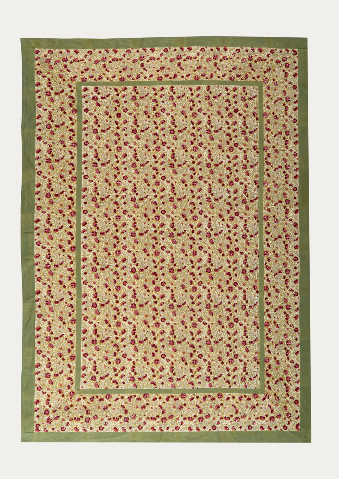 Floral patterned tablecloth with a green border on a white background
