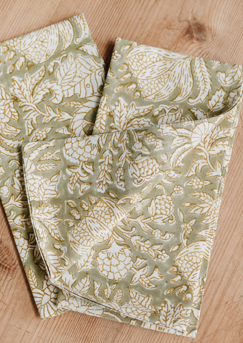 Dried Sage Multi: A pair of block print napkins in sage green with floral print.