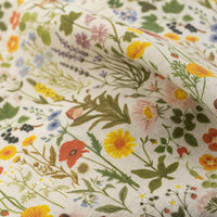 2: A linen tea towel with multicolor floral/botanical print.