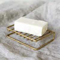 3: A wire brass soap stand.