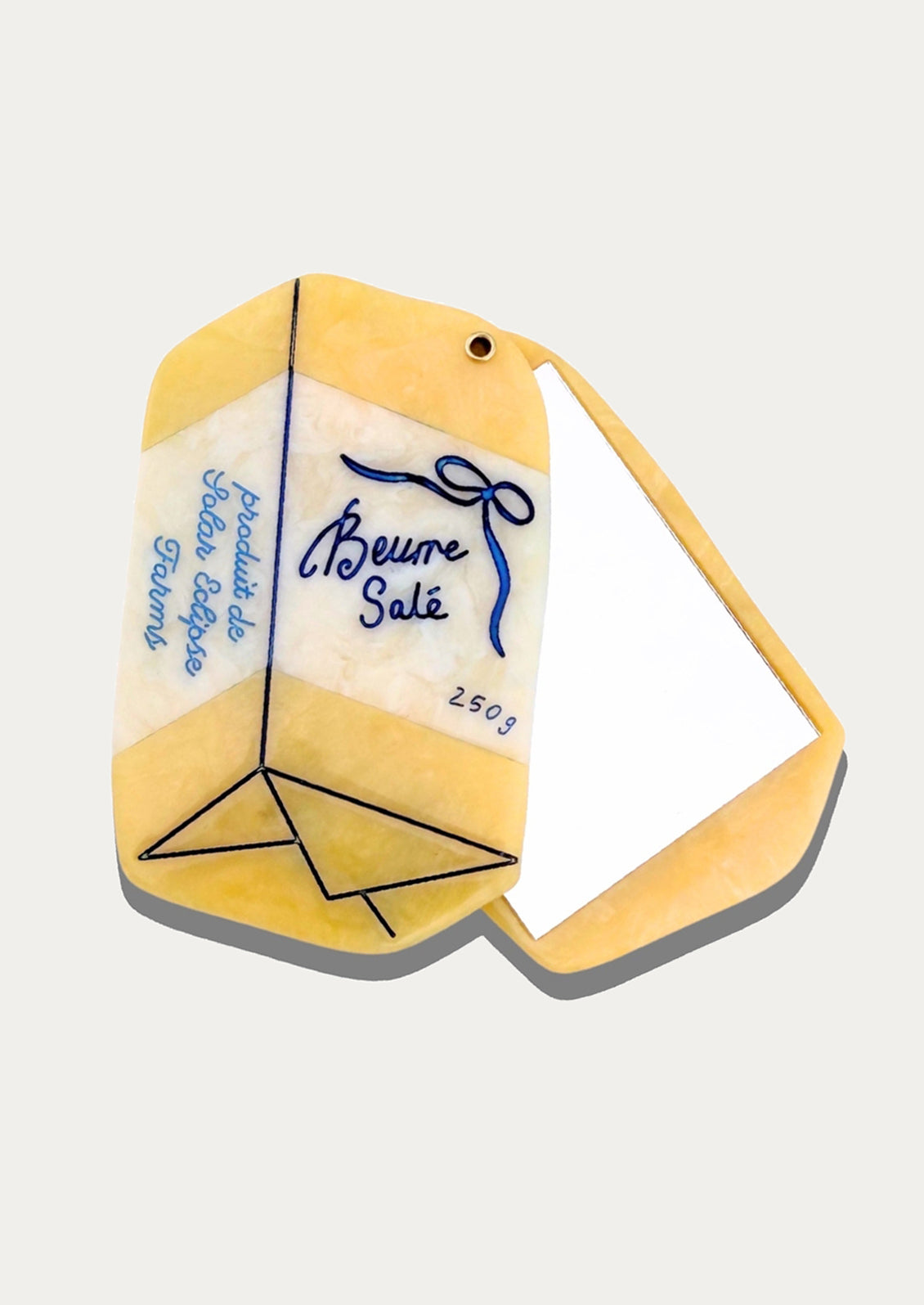 Butter shaped compact mirror.