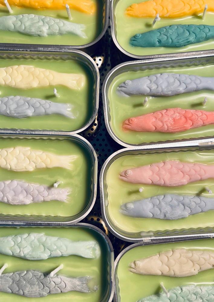 2: Multicolor tin of sardine candles.