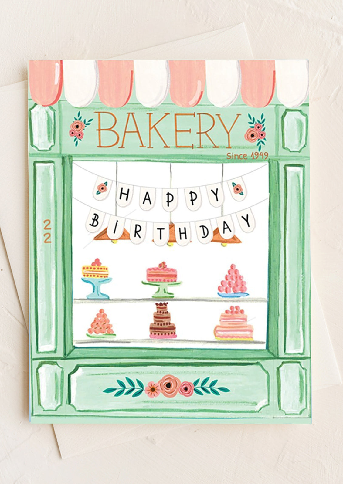 A greeting card with illustration of cake shop.