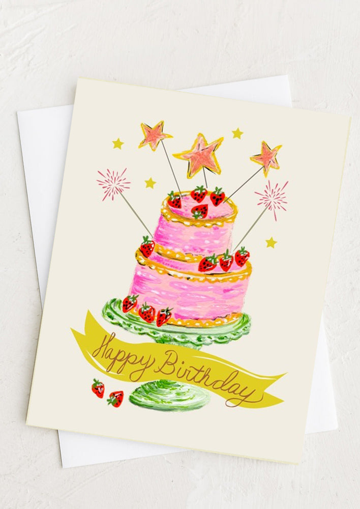 A birthday card with pink illustrated cake.