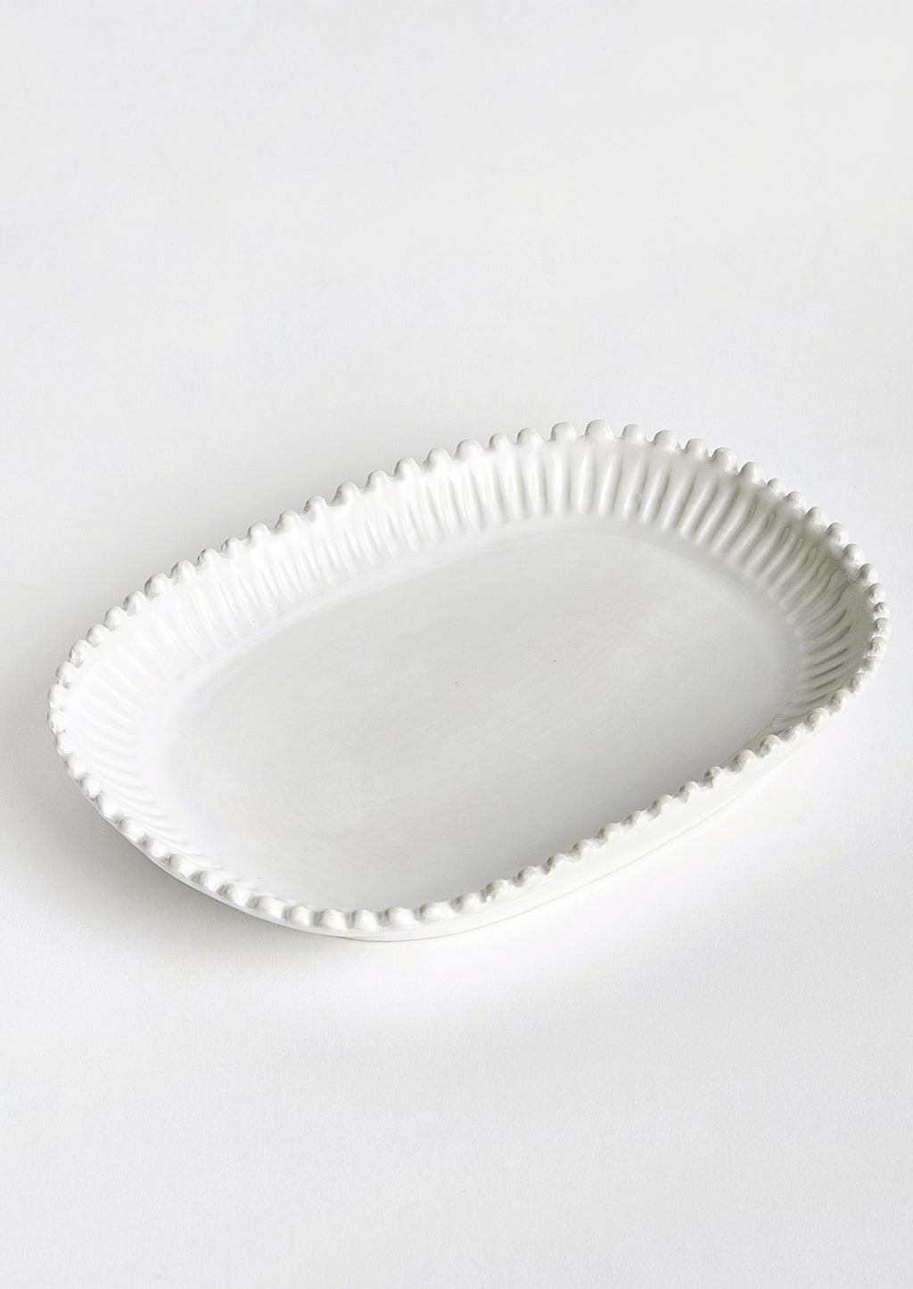 2: A rectangular ceramic platter in white with rounded edges and hobnail pleated border.