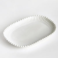 2: A rectangular ceramic platter in white with rounded edges and hobnail pleated border.