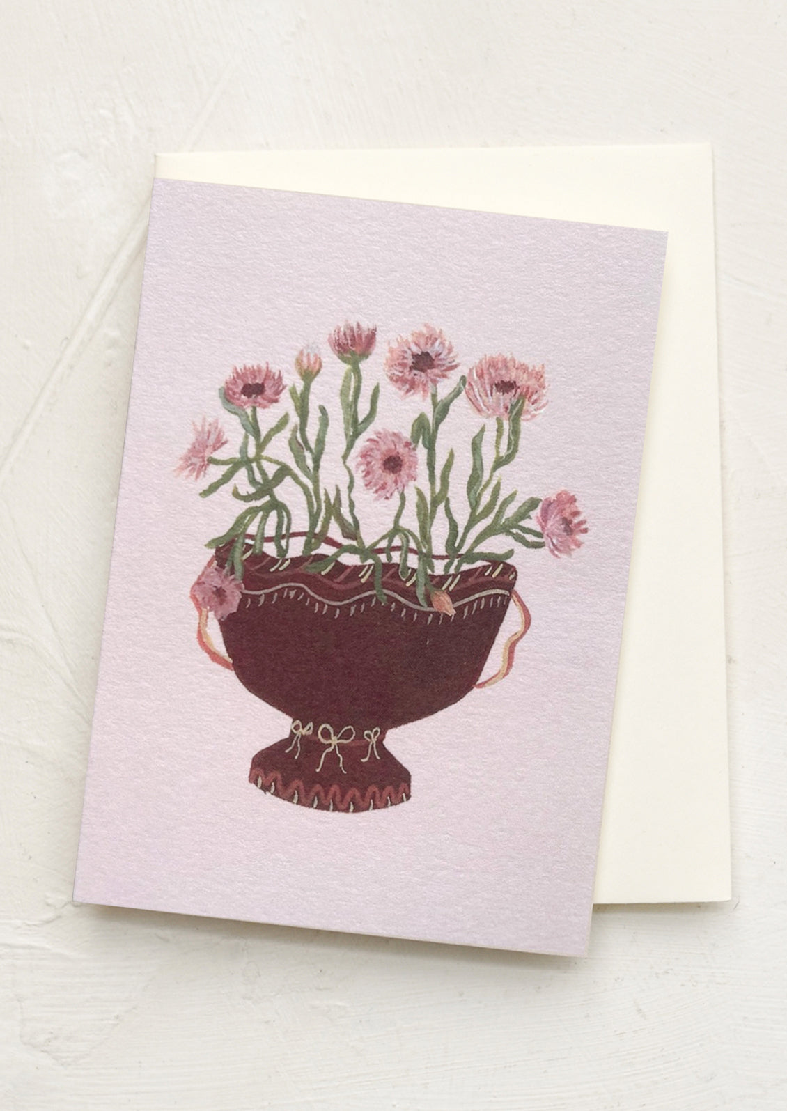 Greeting card with a illustration of a plant in a pot on a light purple background
