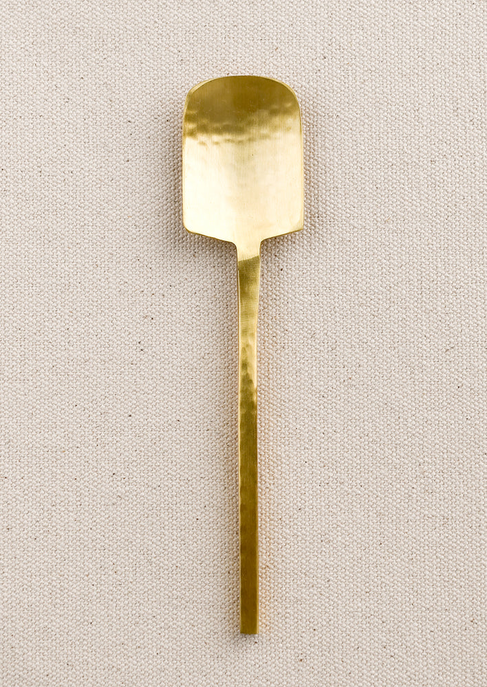 Spoon: A small canape spoon in hammered gold finish.