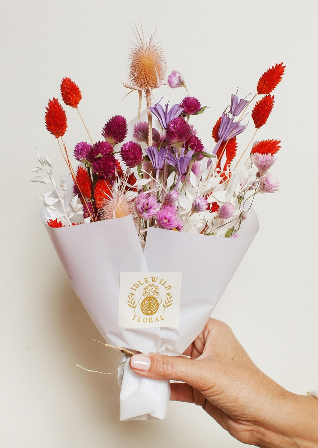 Candy Hearts Multi: A dried floral arrangement in red and purple.