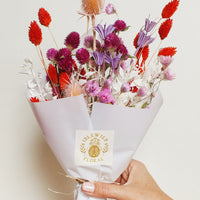 Candy Hearts Multi: A dried floral arrangement in red and purple.