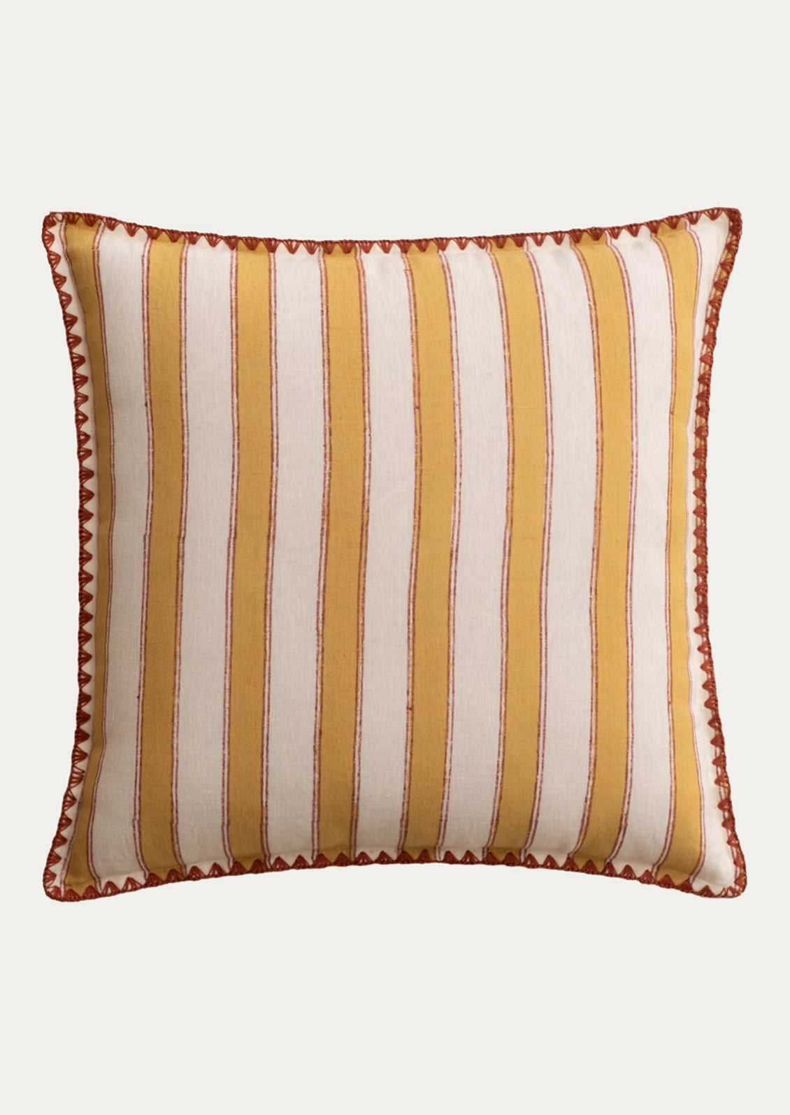 A square decorative throw pillow with vertical stripes in mustard yellow and cream, finished with a brown embroidered border.