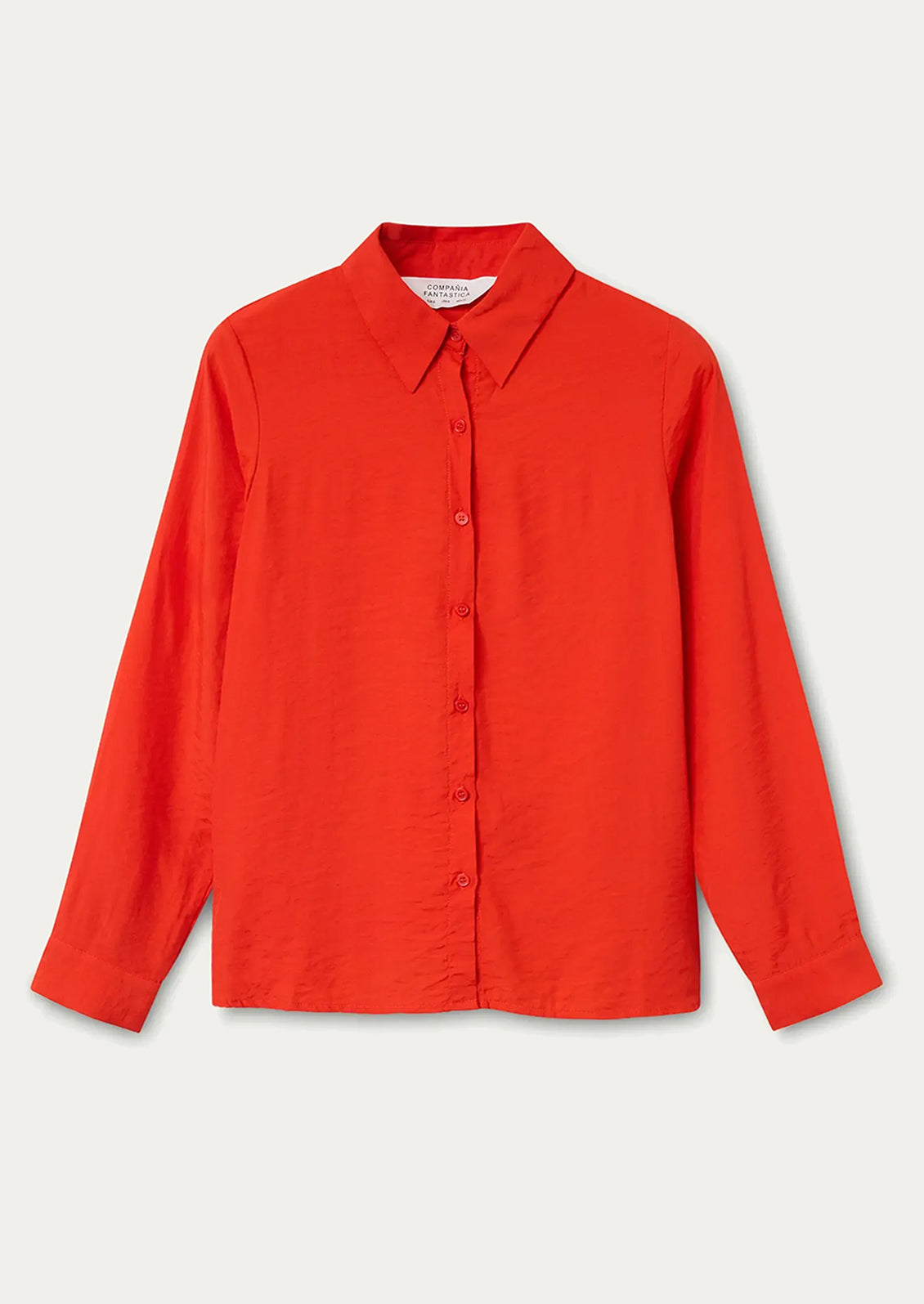A vibrant red-orange button up collared shirt.