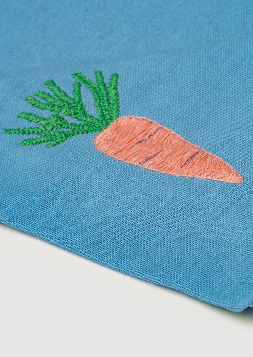 2: Carrot embroidery detailing.