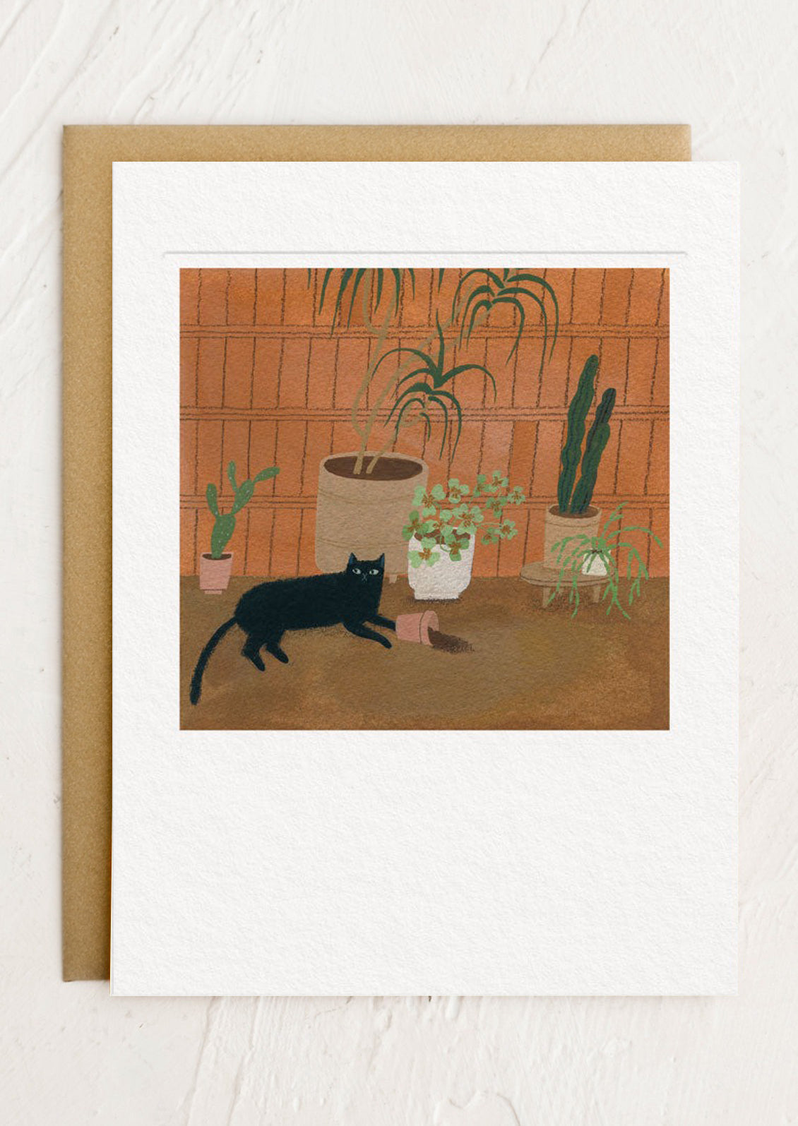 A greeting card with illustration of a black cat among potted plants on a wooden floor with a brown border.