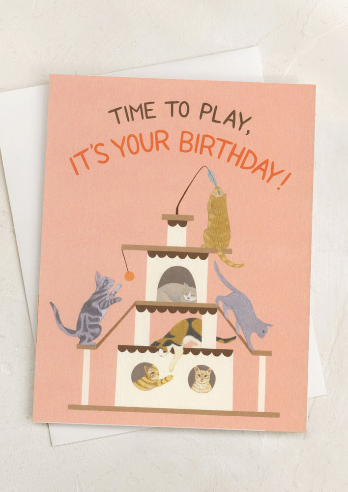 A card with illustration of cats playing, text reads "Time to play, it's your birthday!".