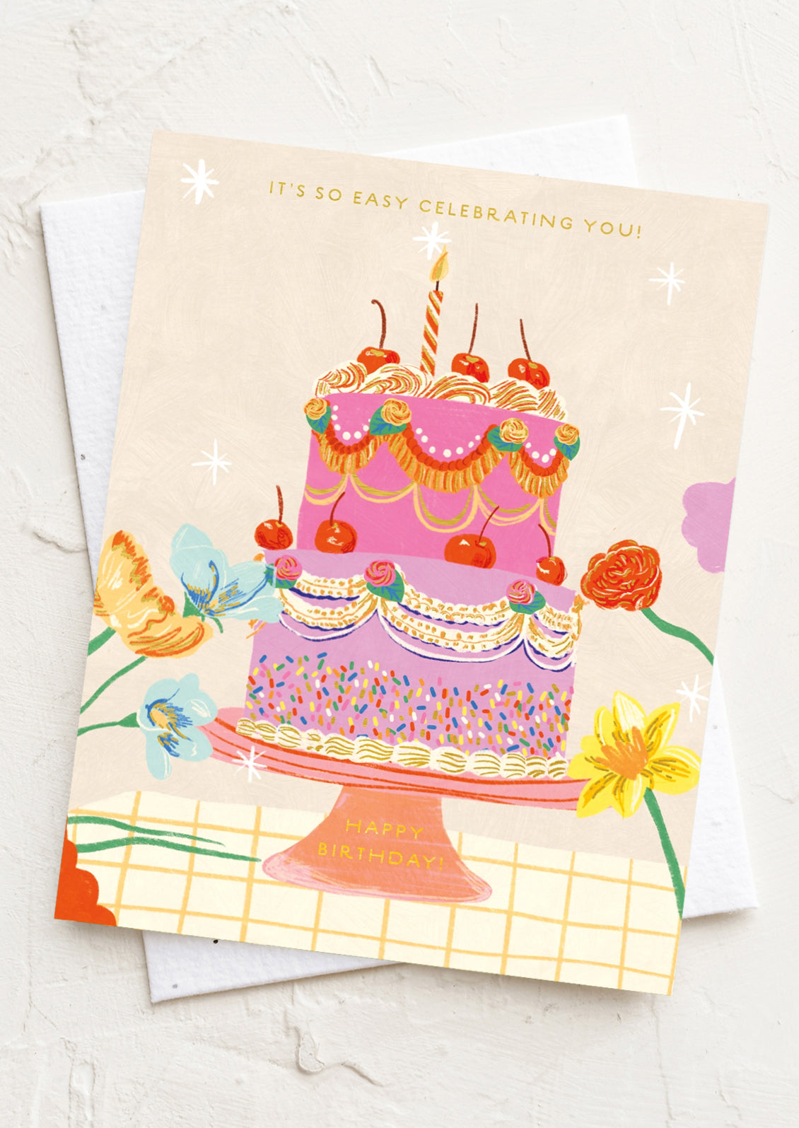 Birthday card with a colorful cake illustration on a white background