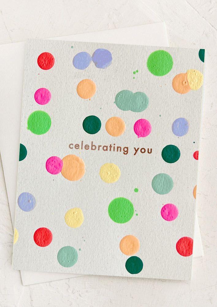 1: A card with colorful dots reading "Celebrating you".
