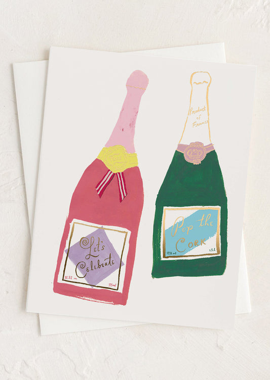 A greeting card with illustration of two bottles of champagne.