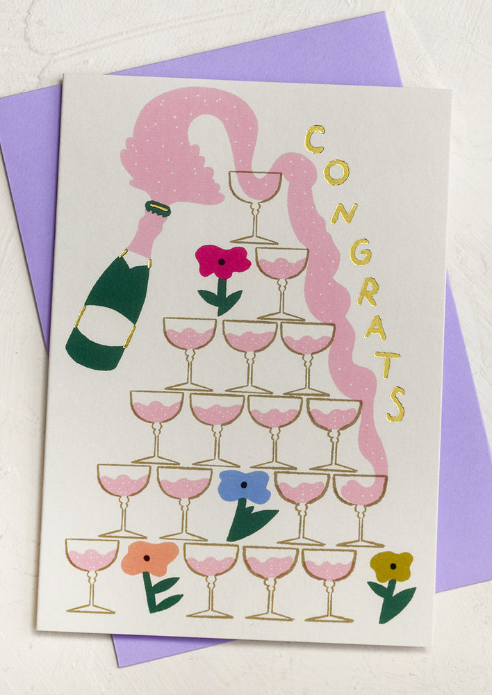1: A greeting card with illustration of champagne tower text reading "Congrats".