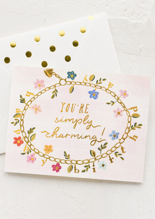 Greeting card with floral design and text on a white background
