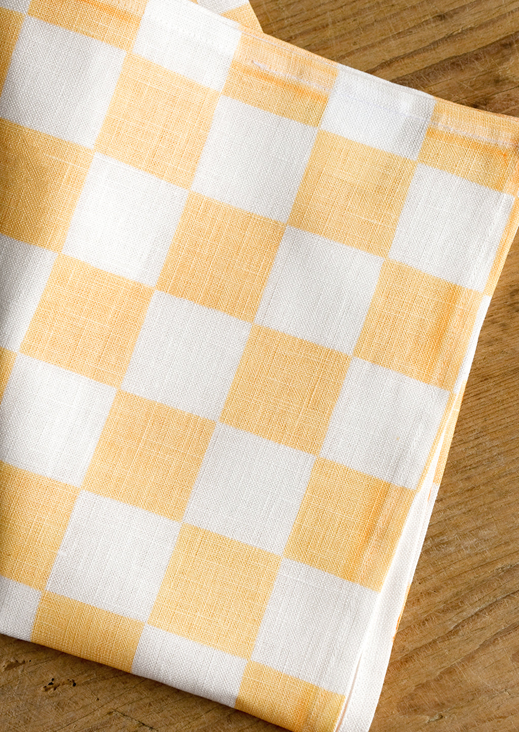 Apricot: A checkered linen tea towel in apricot and white.