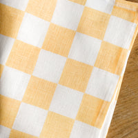 Apricot: A checkered linen tea towel in apricot and white.